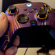 A photo of a Scuf Instinct Pro controller with a lovely purple faceplate.